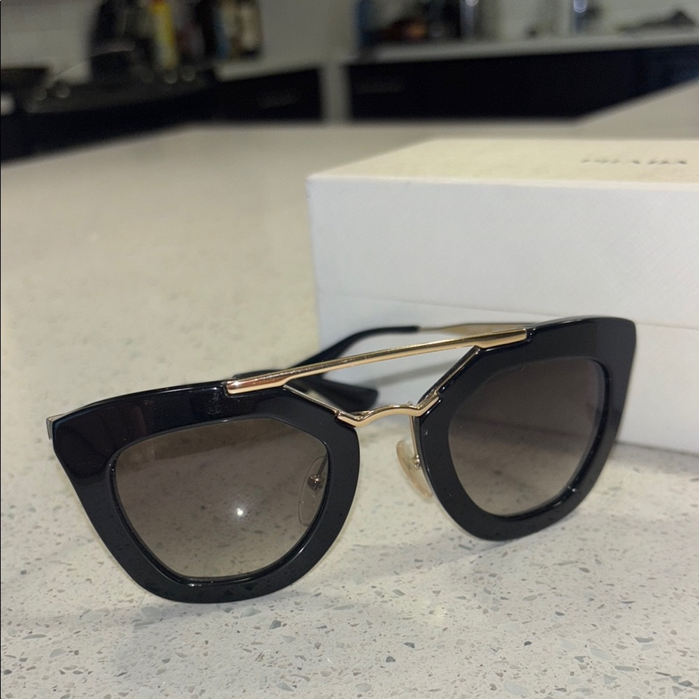 Prada Black and Gold Cat-Eye Sunglasses